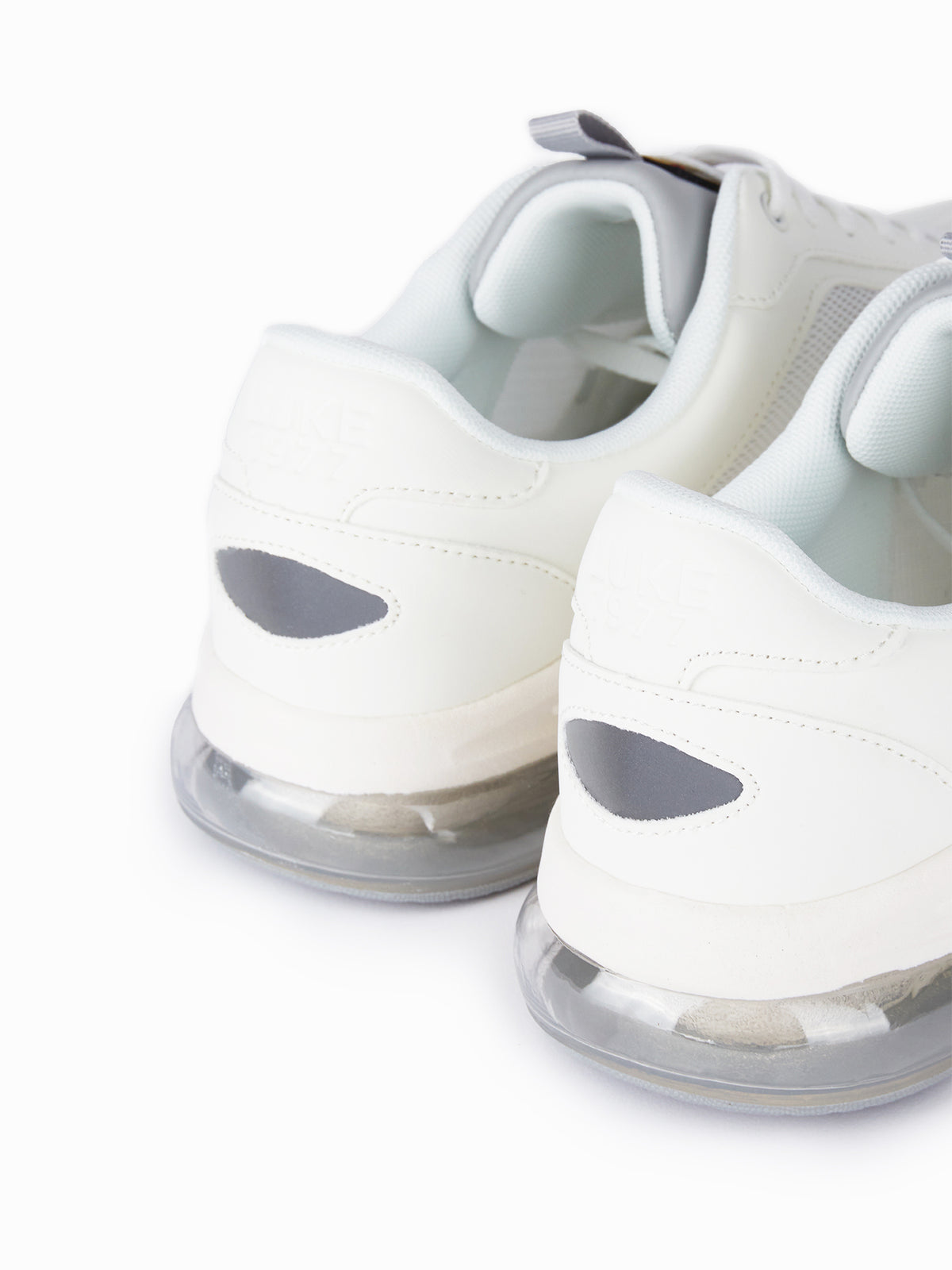 Men's white footwear.
