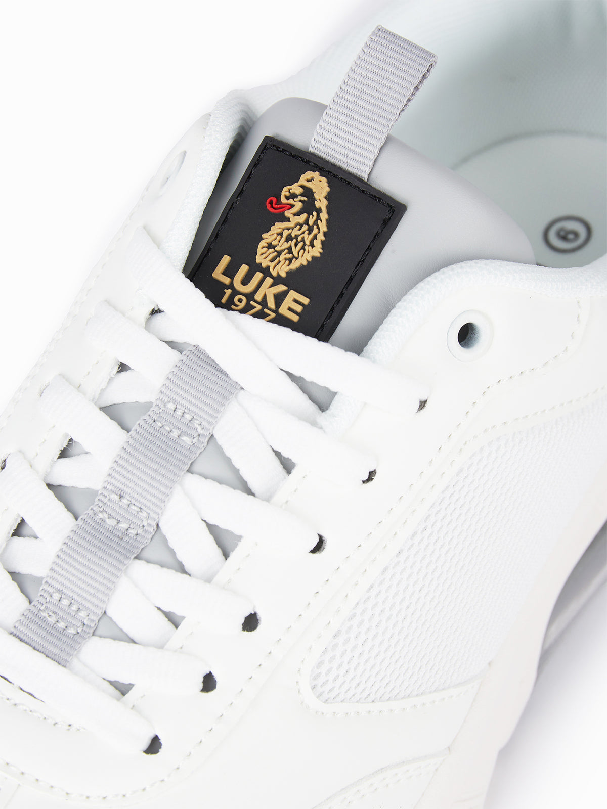 Men's white footwear.