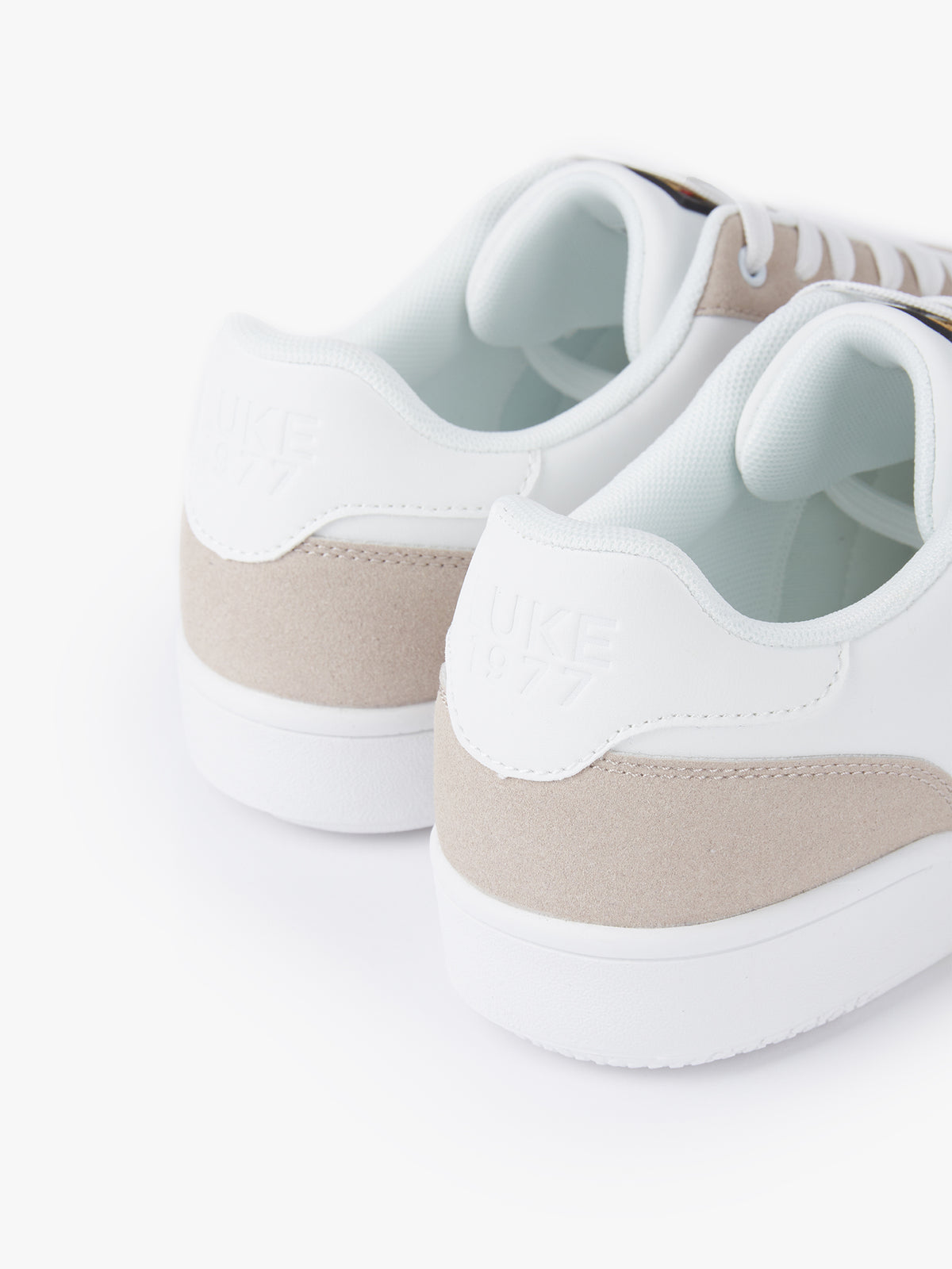 Men's white footwear.