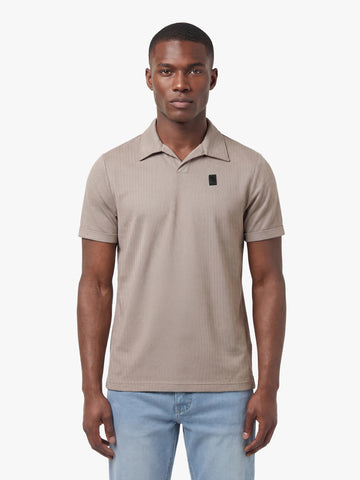 Men's brown polo shirt with polo collar, worn by a model, front view