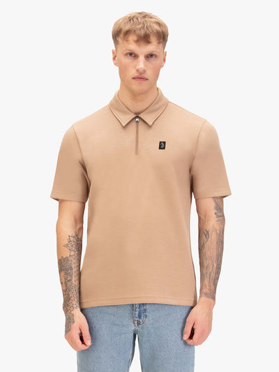 Men's beige polo shirt with polo collar, worn by a model, front view