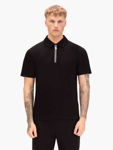 Men's black polo shirt with polo collar, worn by a model, front view