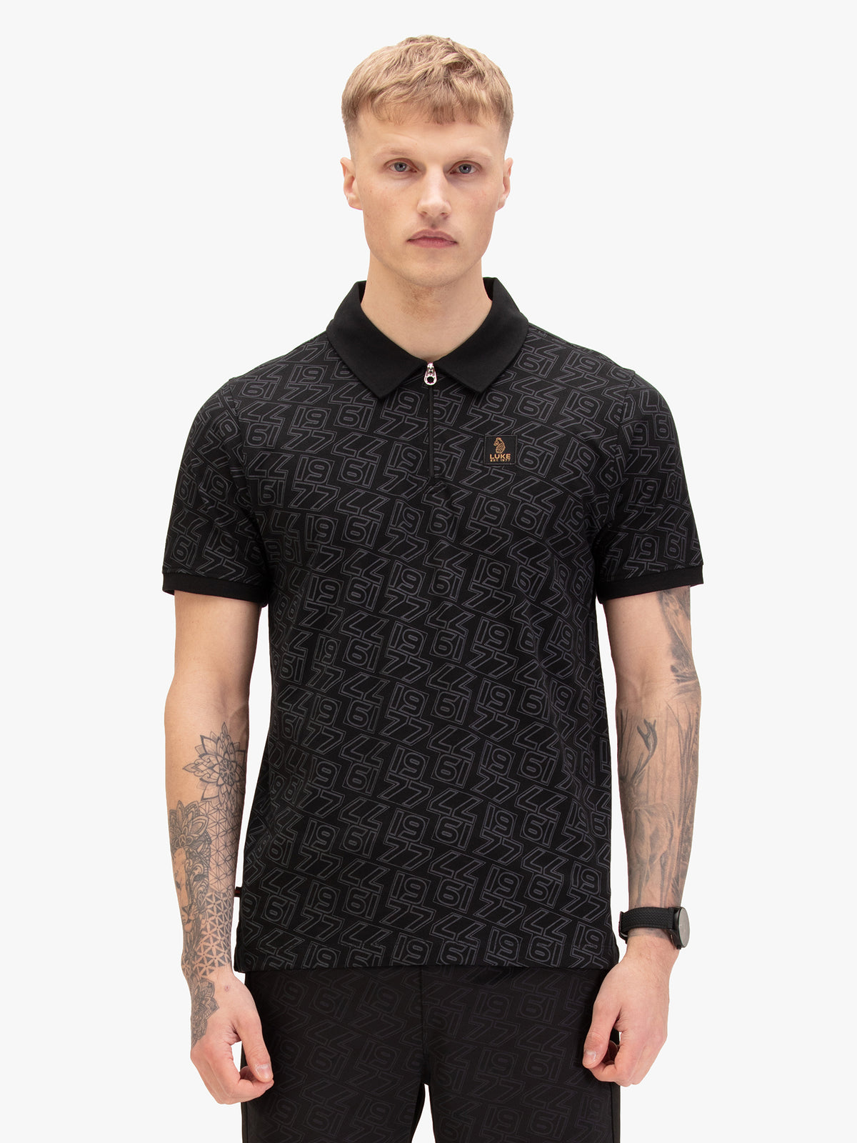 Men's black polo shirt with polo collar, worn by a model, front view