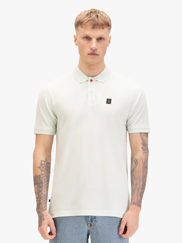 Men's green polo shirt with polo collar, worn by a model, front view