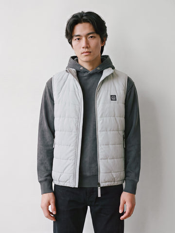 Man wearing ice grey LUKE 1977 Vin gilet over a grey hoodie, front view