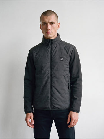Man wearing black LUKE 1977 Vin contrast sleeve jacket zipped up, front view