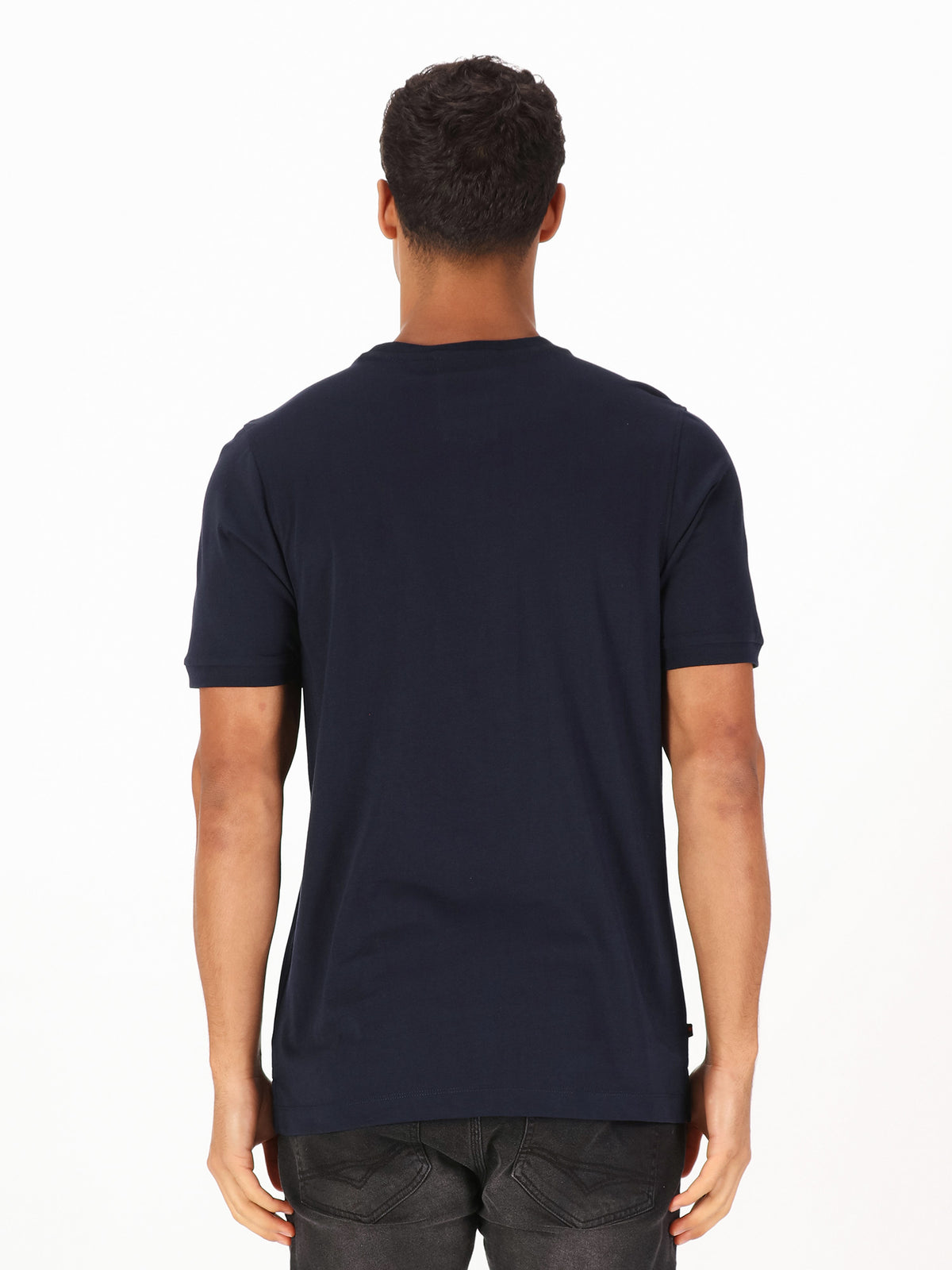Men's navy t-shirt with crew neck and short sleeves worn by a model - back view.