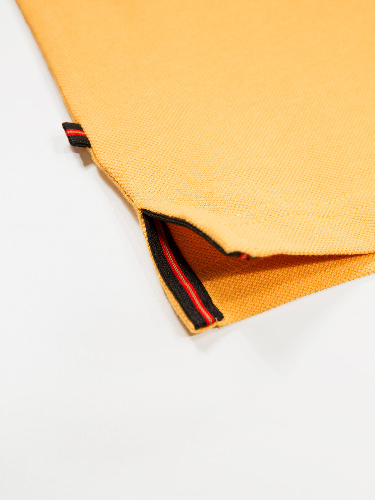 Men's yellow polo shirt with polo collar.