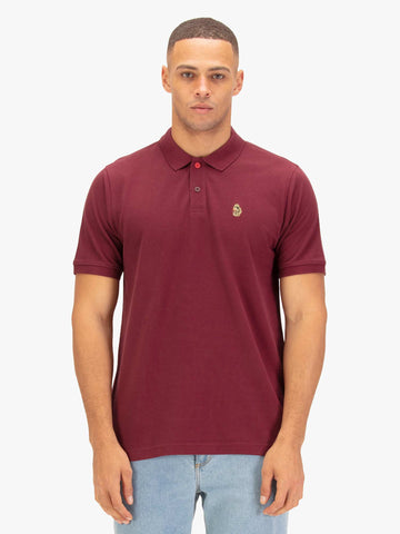 Men's red polo shirt with polo collar, worn by a model, front view