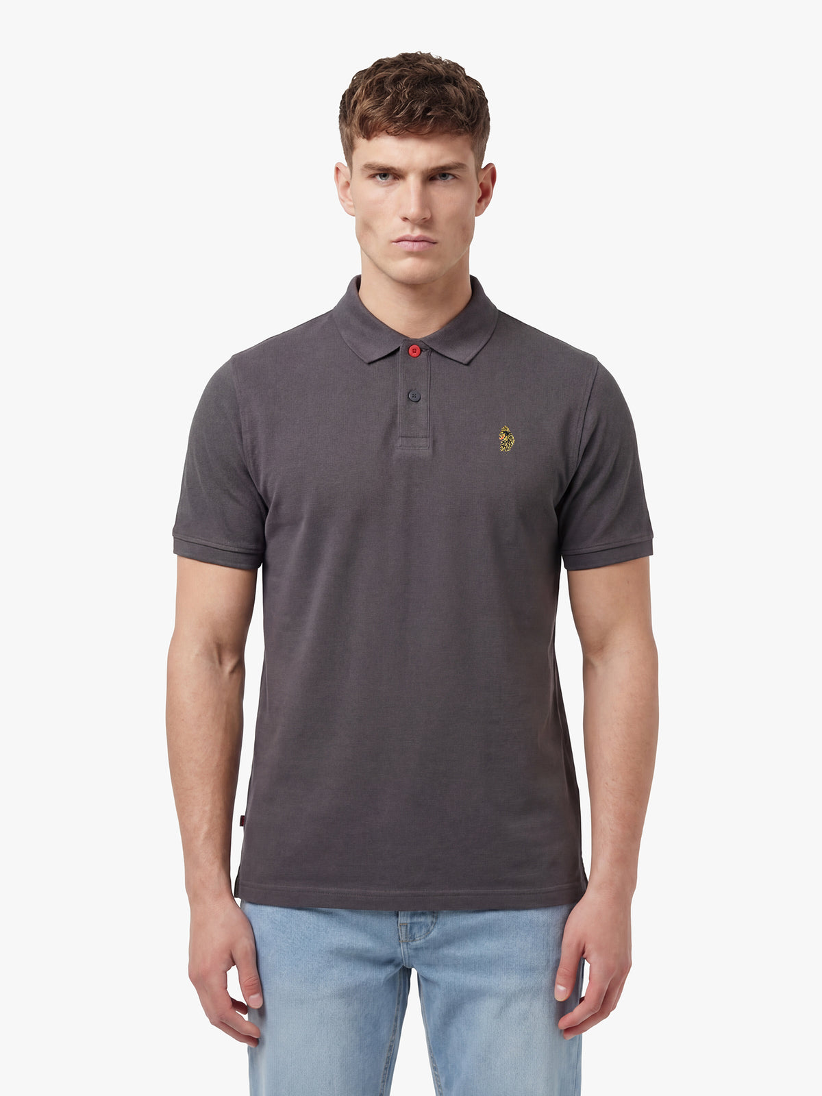 Man wearing charcoal LUKE 1977 New Mead cotton piqué polo shirt with jeans, front view