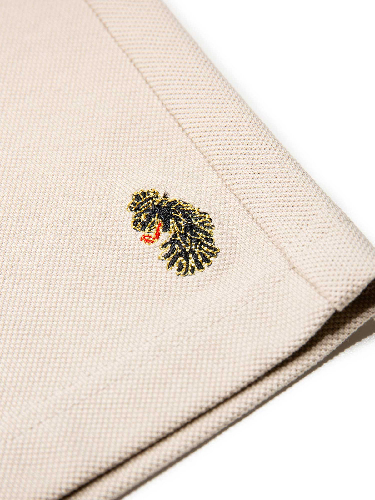 Men's beige short set with short-sleeve shirt and drawstring shorts, detail view.