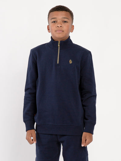 Boy's sweatshirt with quarter-zip and fleece worn by model, front view